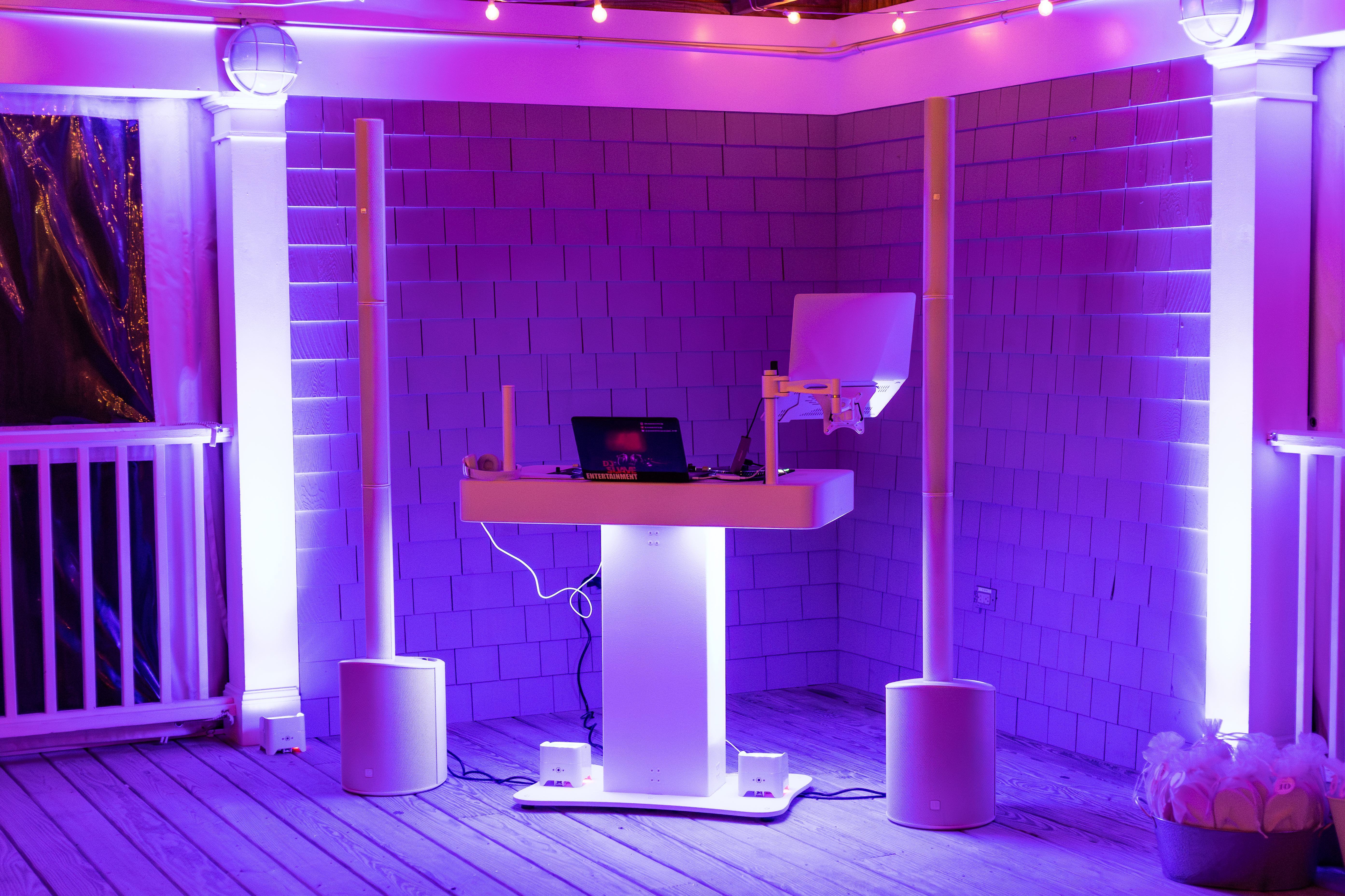 DJ setup with purple lighting